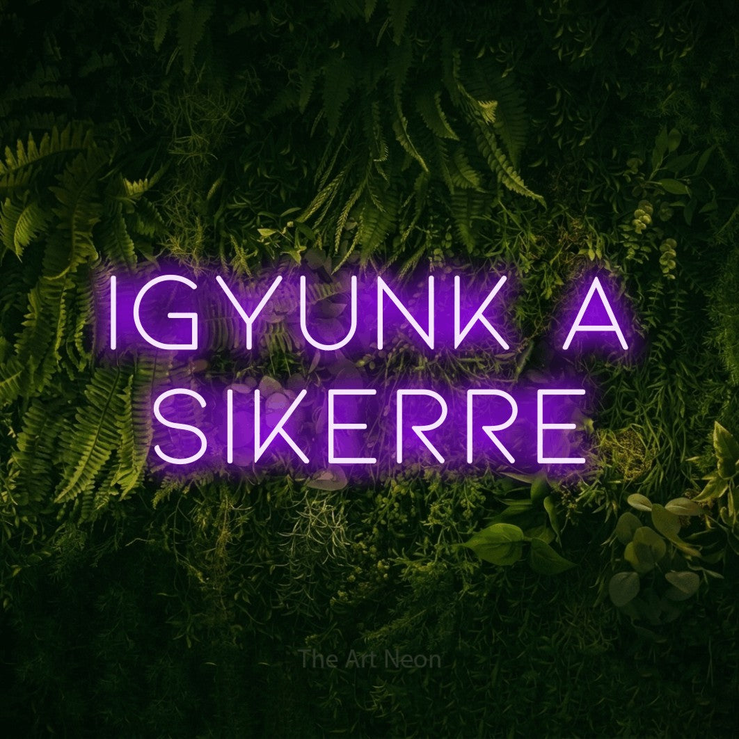 LED neon sign reading “IGYUNK A SIKERRE”, arranged in two lines.