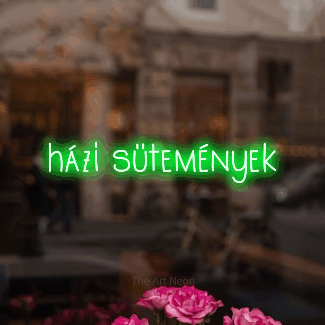 LED neon sign reading “házi sütemények”, arranged in a single line.