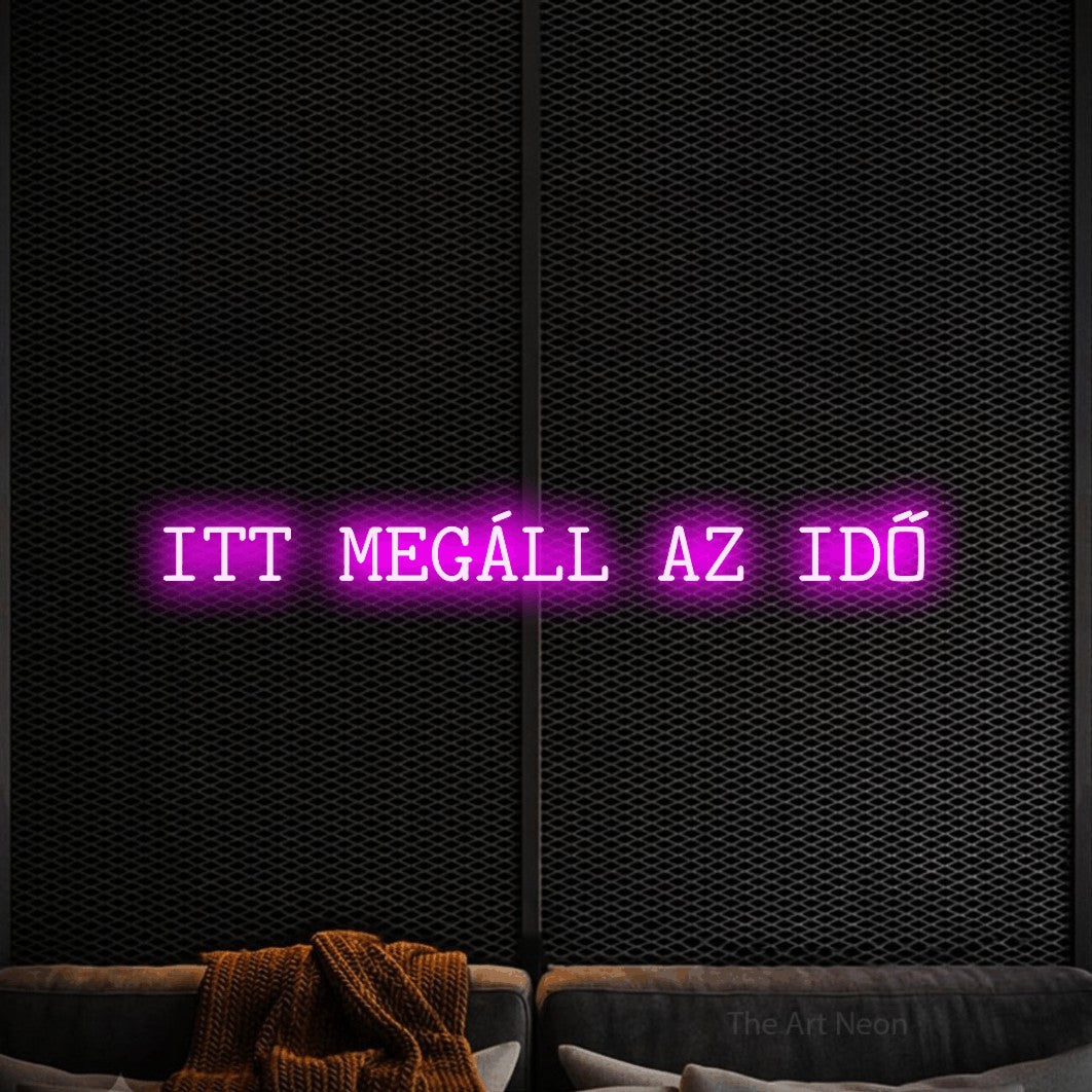 LED neon sign reading “ITT MEGÁLL AZ IDŐ”, arranged in a single line.