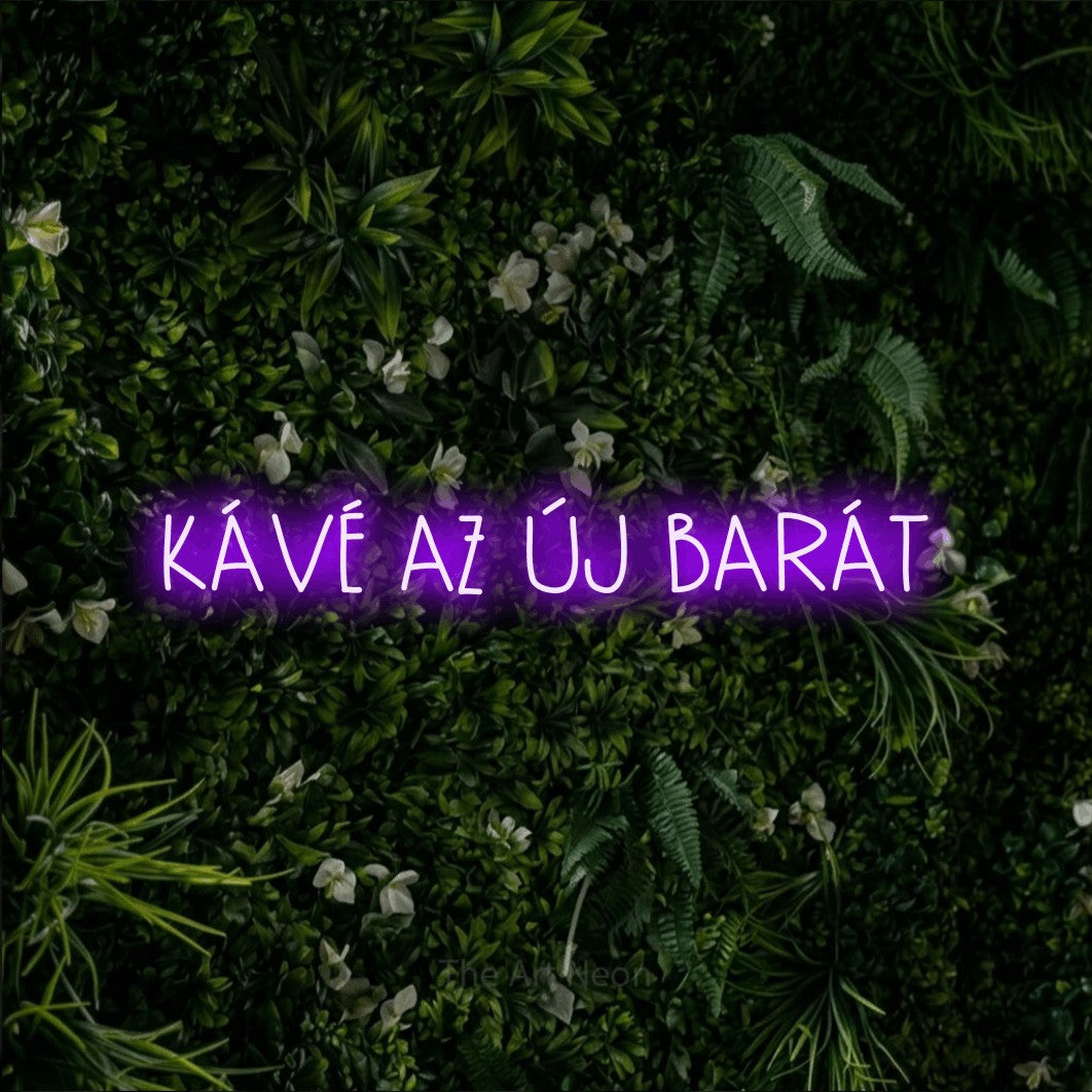 LED neon sign reading “KÁVÉ AZ ÚJ BARÁT”, arranged in a single line.