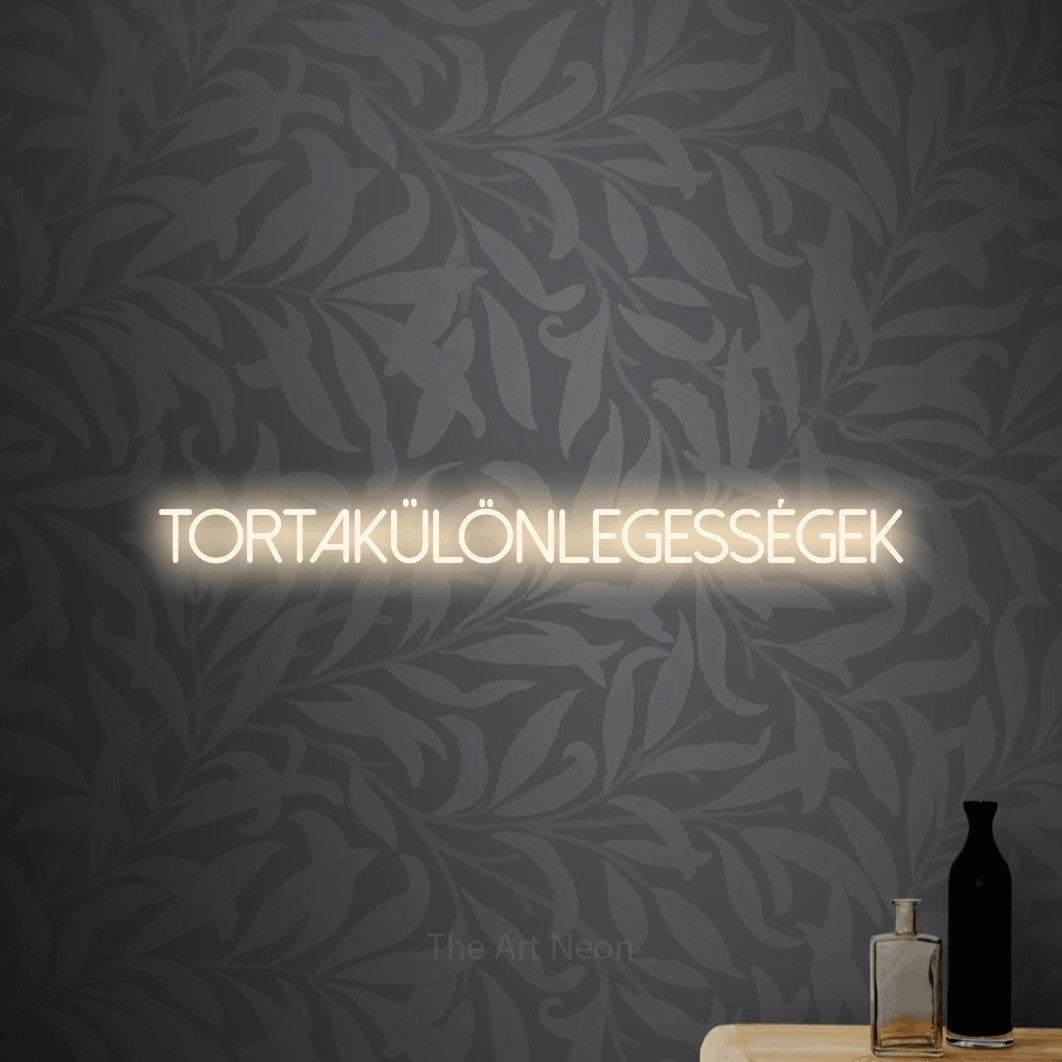 LED neon sign reading “tortakülönlegességek”, arranged in a single line.
