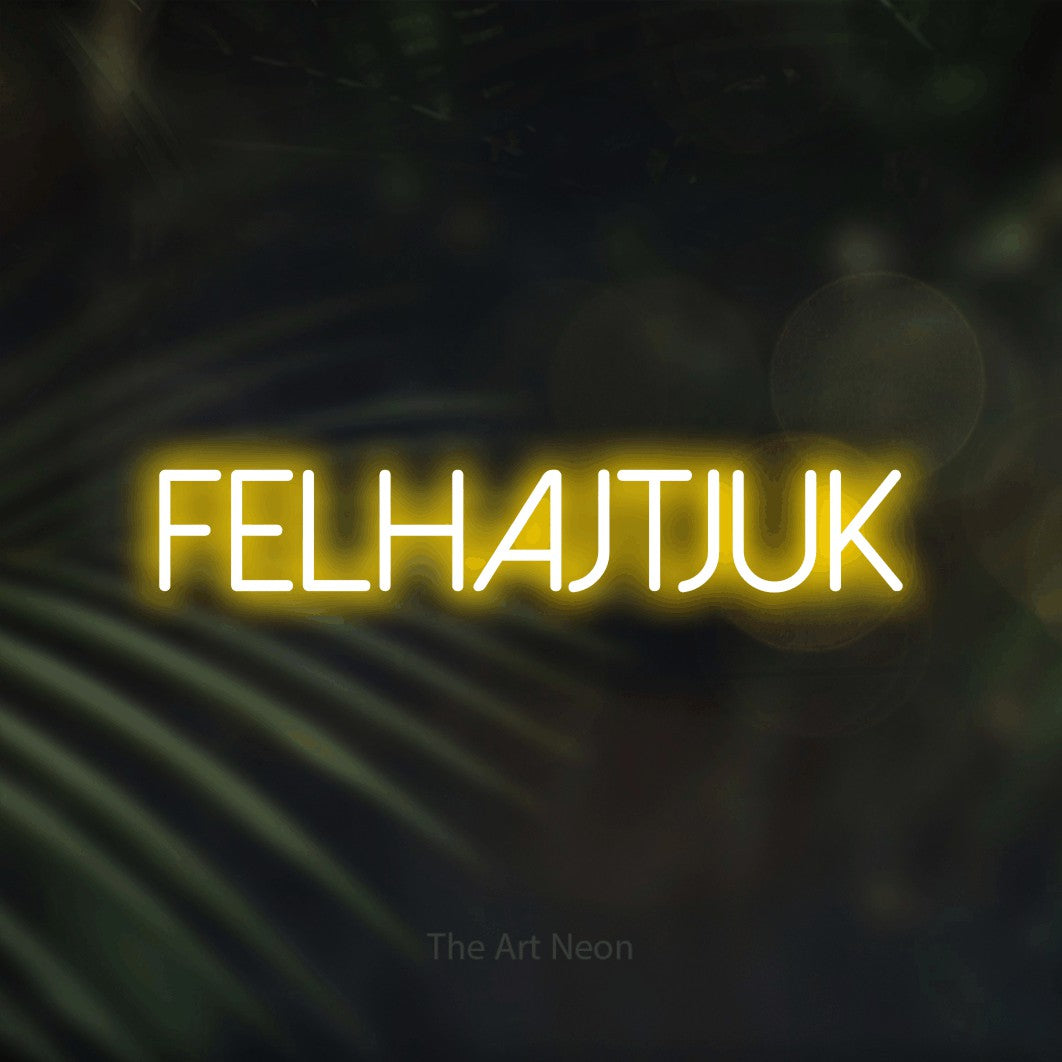 LED neon sign reading “felhajtjuk”, arranged in a single line.