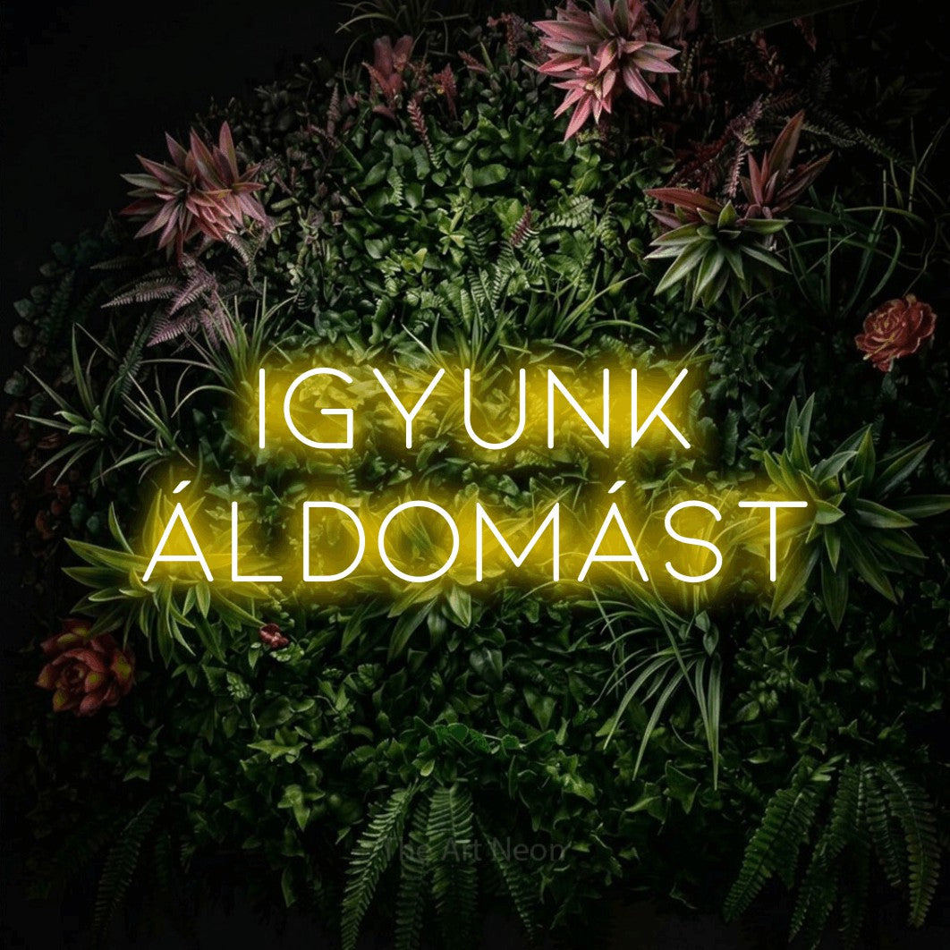 LED neon sign reading “igyunk áldomást”, arranged in two lines.