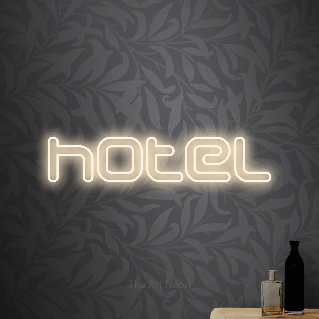 LED neon sign reading “hotel”, arranged in a single line.