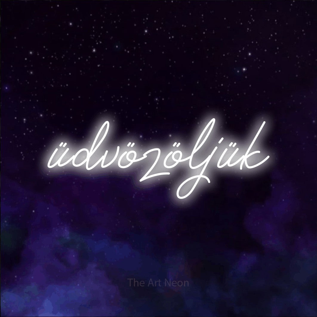 LED neon sign reading “üdvözöljük”, arranged in a single line.