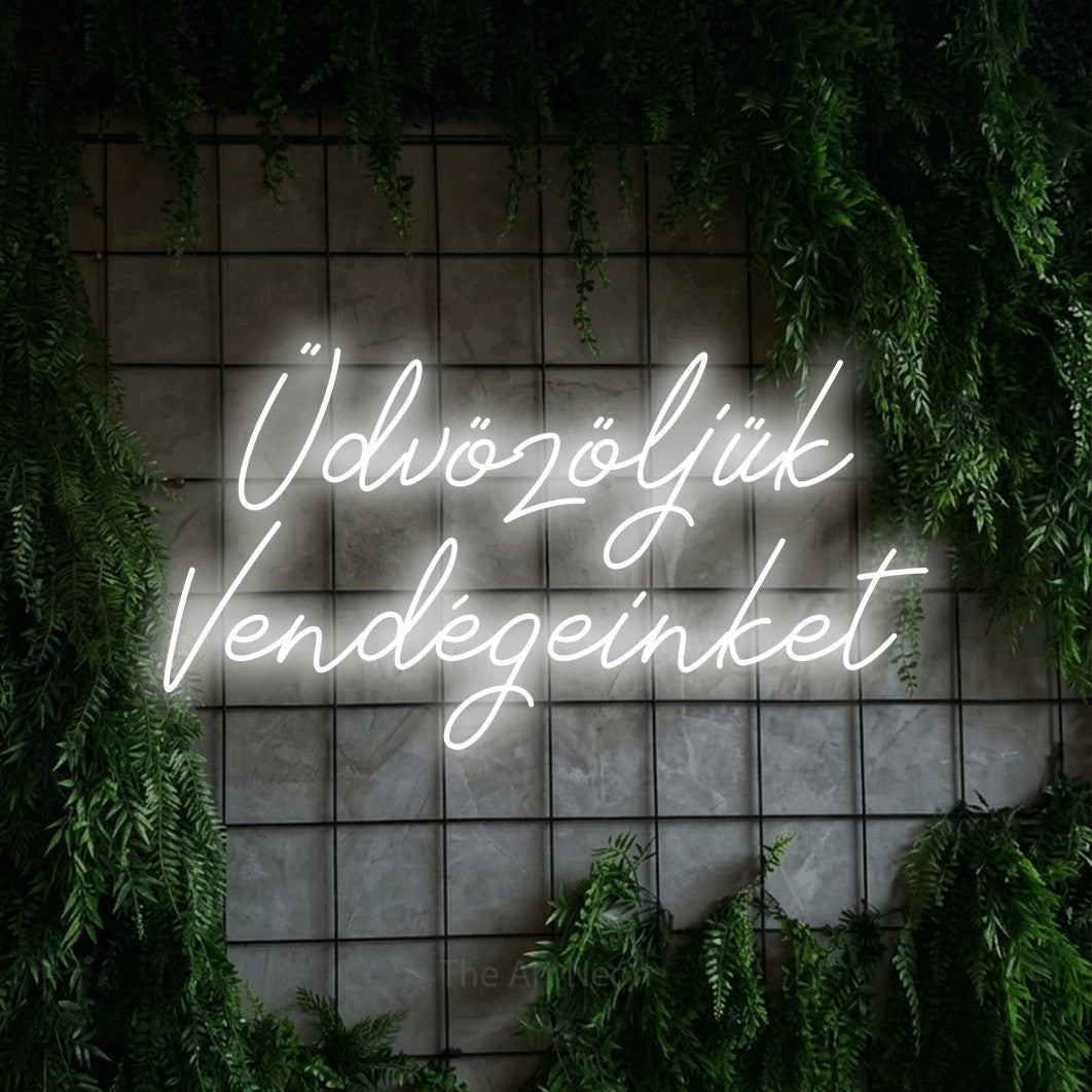 LED neon sign reading “Üdvözöljük Vendégeinket”, arranged in two lines.
