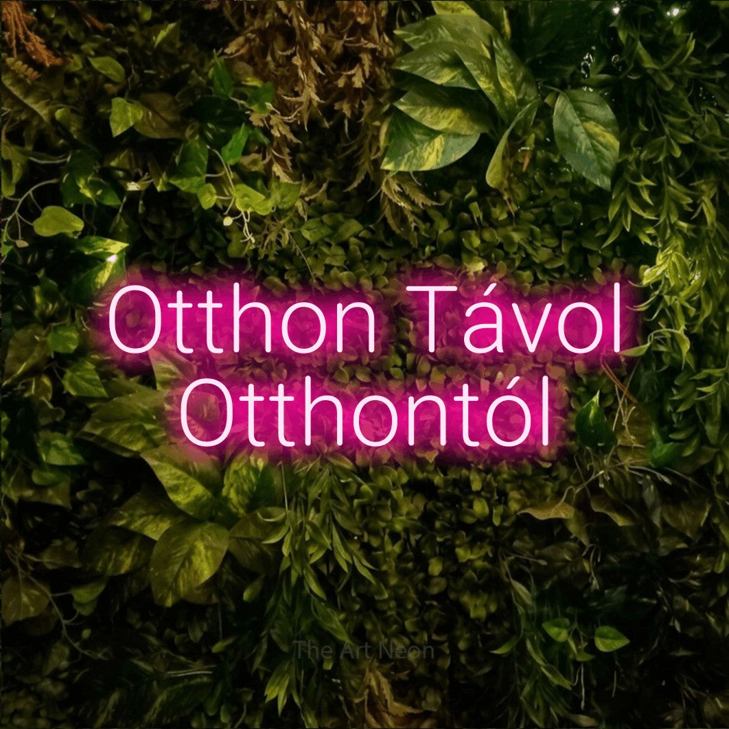 LED neon sign reading “Otthon Távol Otthontól”, arranged in two lines.