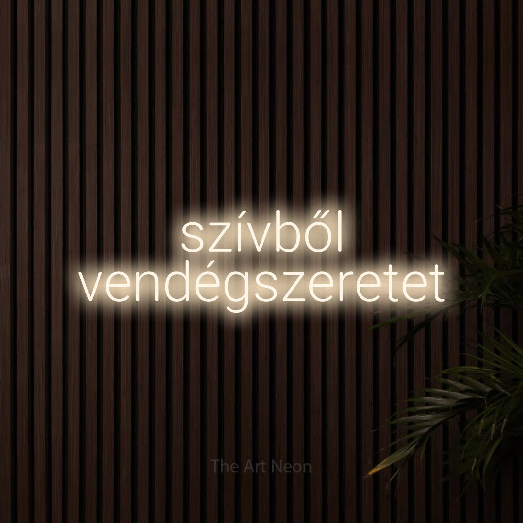 LED neon sign reading “szívből vendégszeretet”, arranged in two lines.