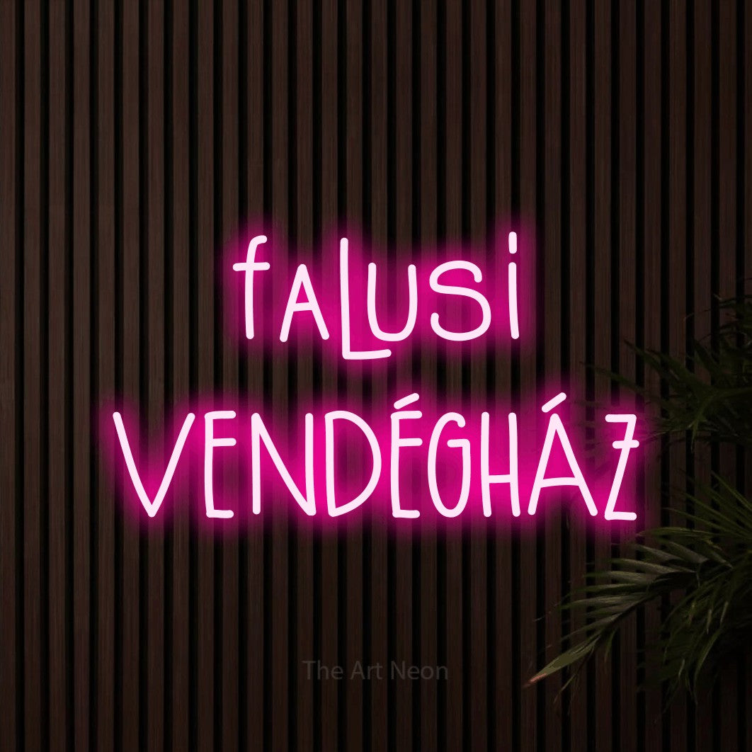 LED neon sign reading “falusi VENDÉGHÁZ”, arranged in two lines.