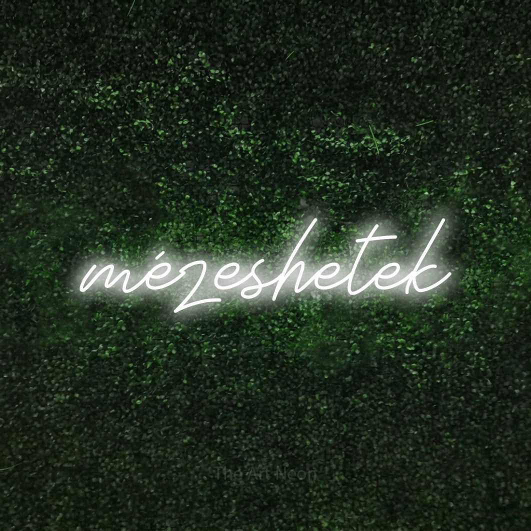 LED neon sign reading “mézeshetek”, arranged in a single line.