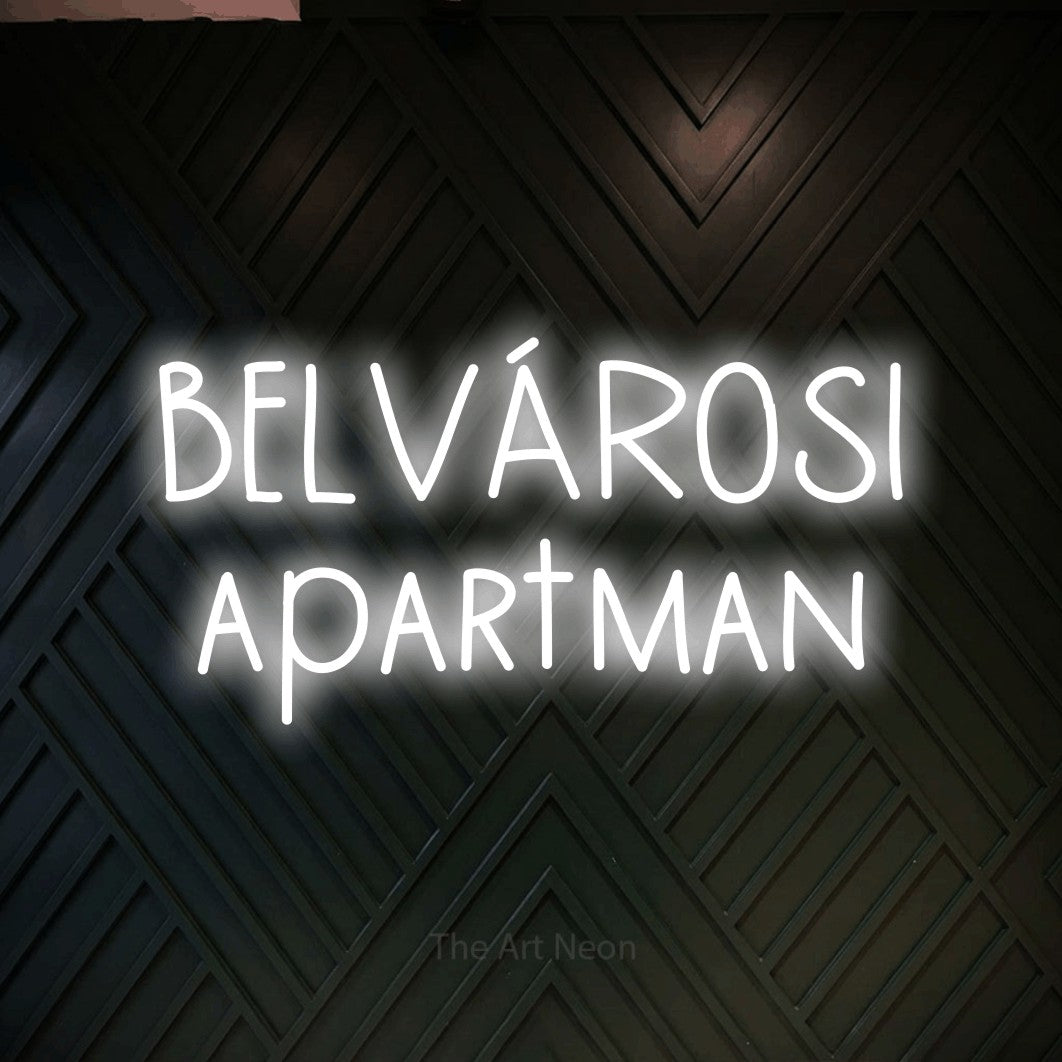 LED neon sign reading “BELVÁROSI apartman”, arranged in two lines.