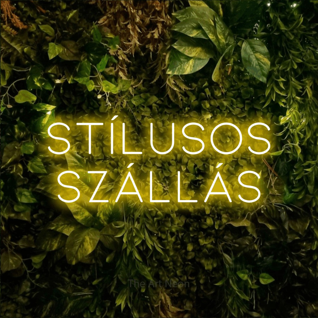 LED neon sign reading “STÍLUSOS SZÁLLÁS”, arranged in two lines.