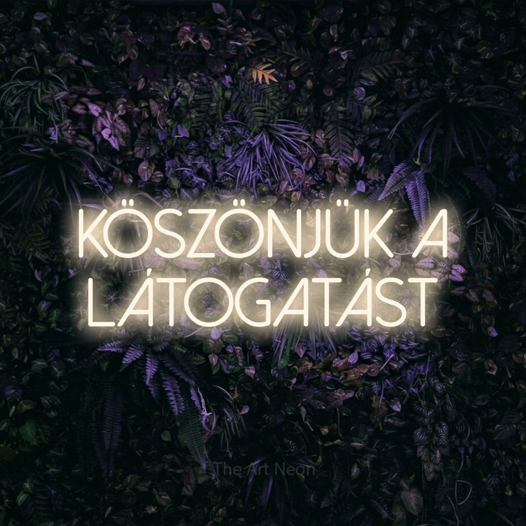 LED neon sign reading “KÖSZÖNJÜK A LÁTOGATÁST”, arranged in two lines.