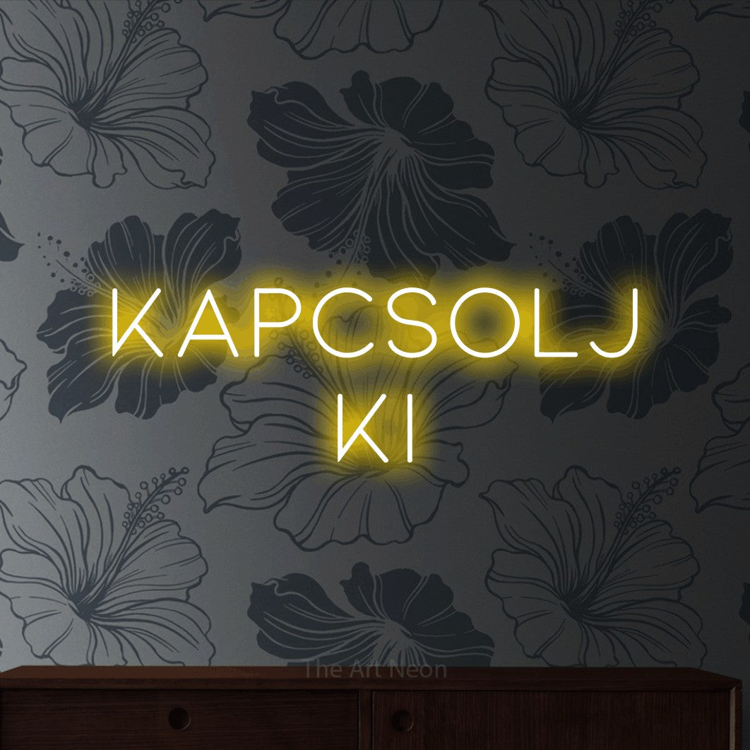LED neon sign reading “KAPCSOLJ KI”, arranged in two lines.