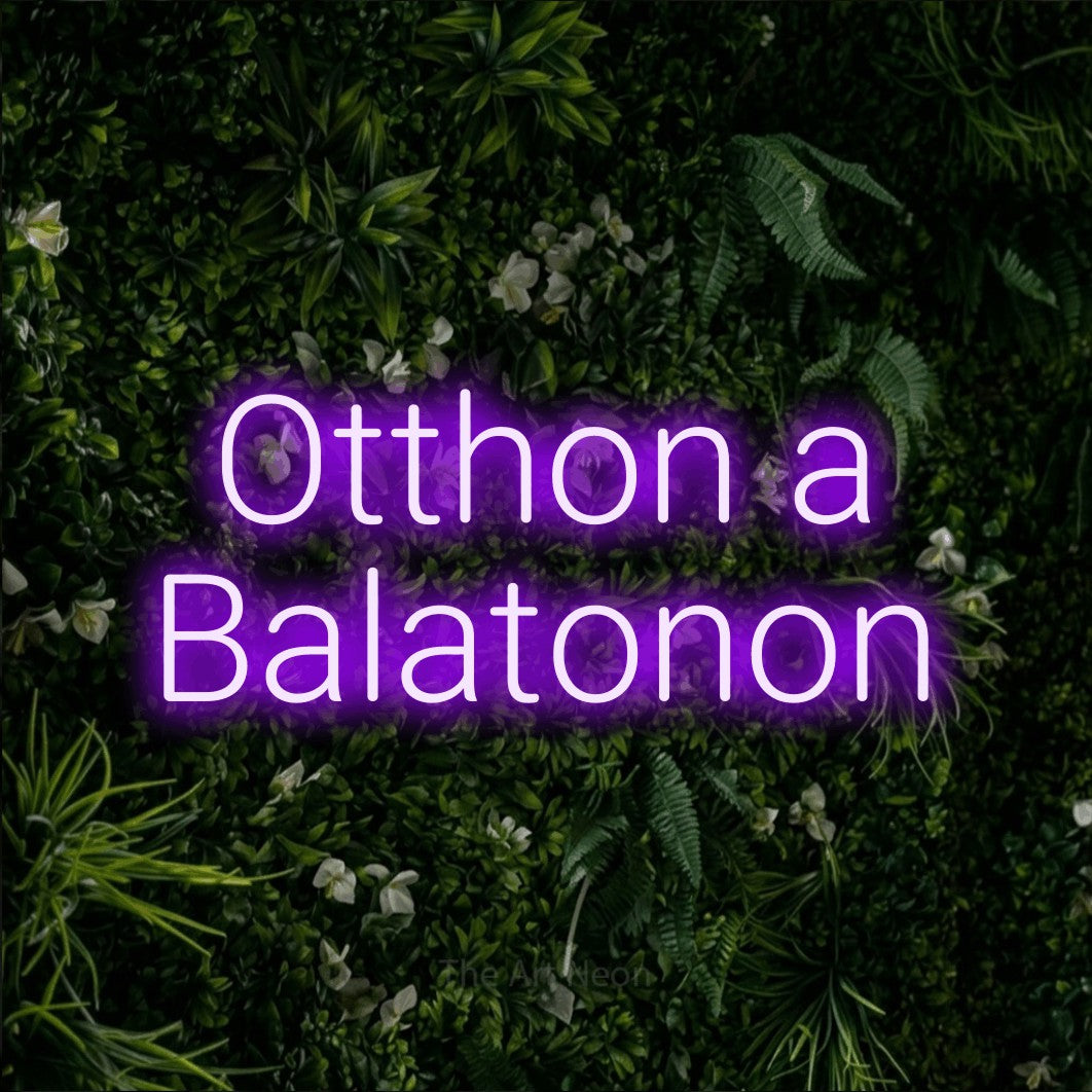 LED neon sign reading “Otthon a Balatonon”, arranged in two lines.