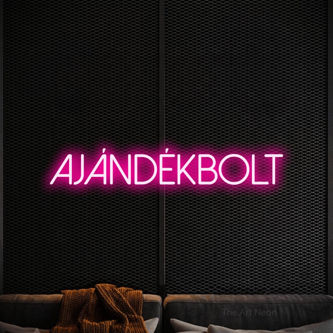LED neon sign reading “AJÁNDÉKBOLT”, arranged in a single line.