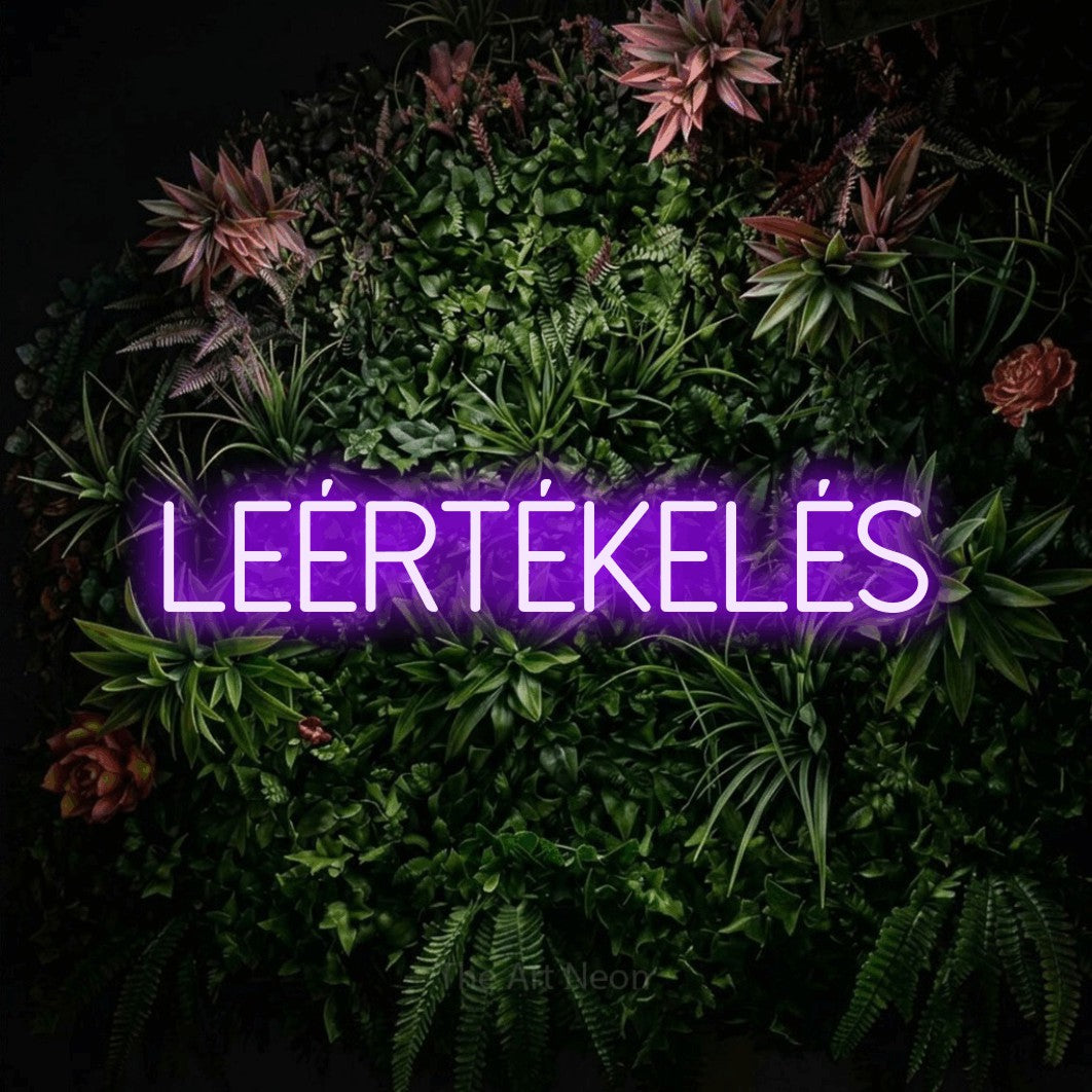 LED neon sign reading “LEÉRTÉKELÉS”, arranged in a single line.