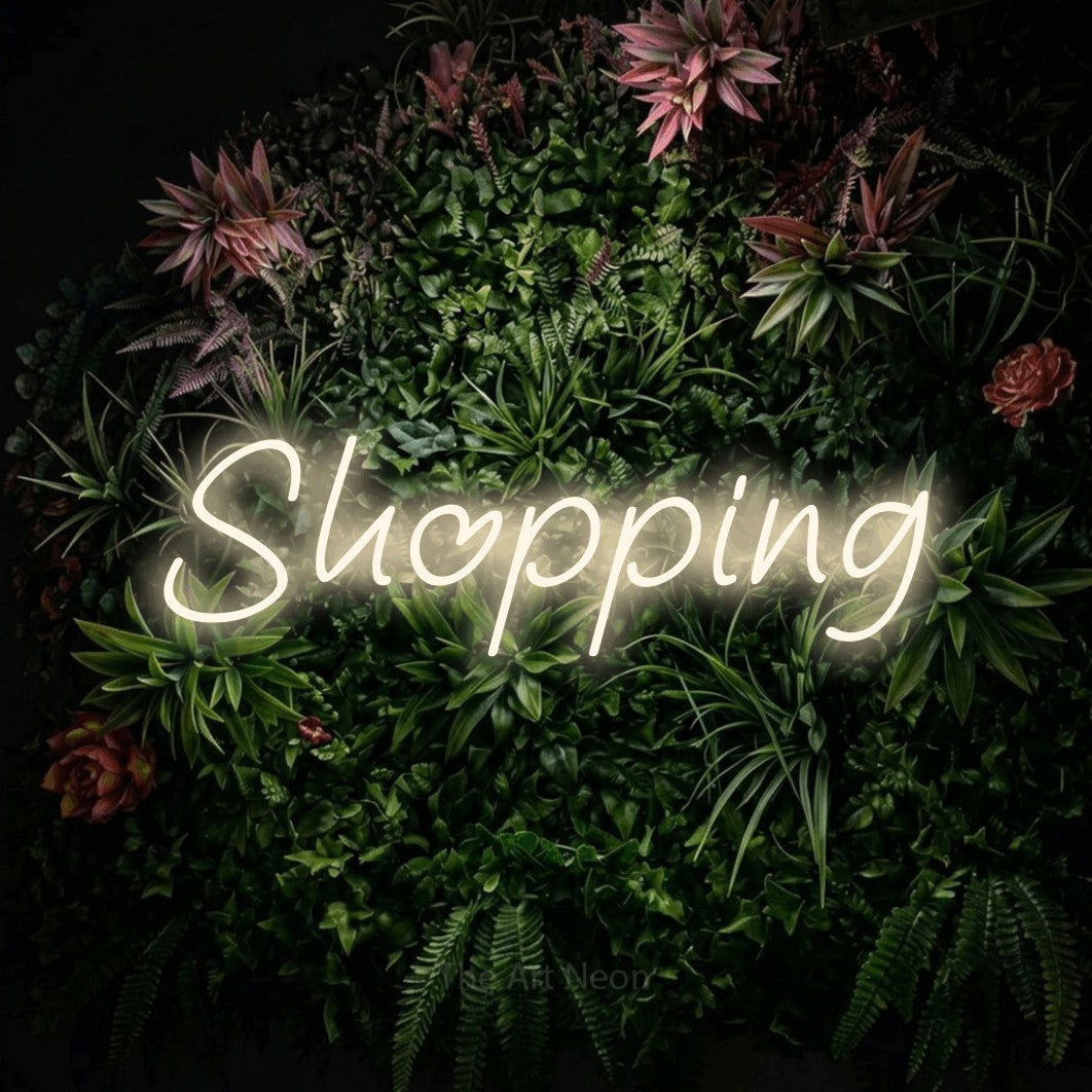 LED neon sign reading “Shopping”, arranged in a single line.