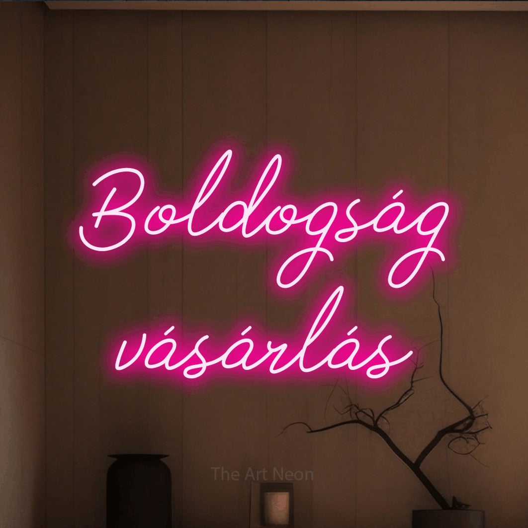 LED neon sign reading “Boldogság vásárlás”, arranged in two lines.