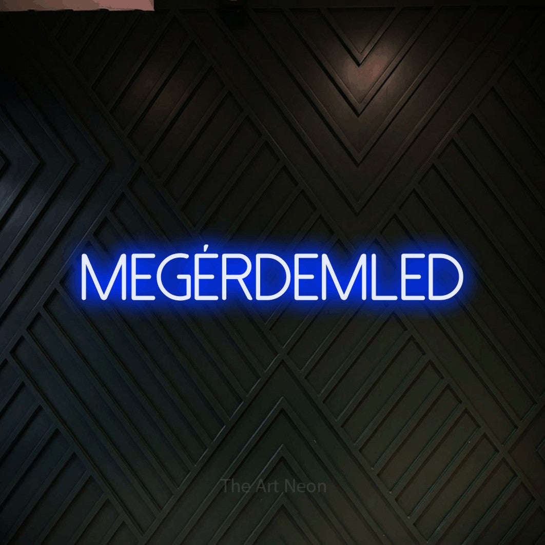 LED neon sign reading “MEGÉRDEMLED”, arranged in a single line.
