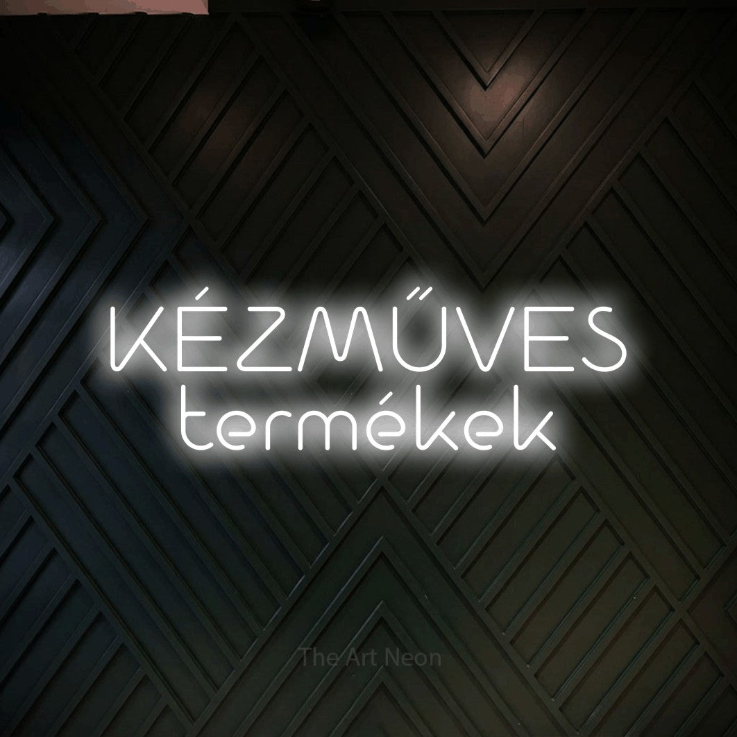 LED neon sign reading “KÉZMŰVES termékek”, arranged in two lines.