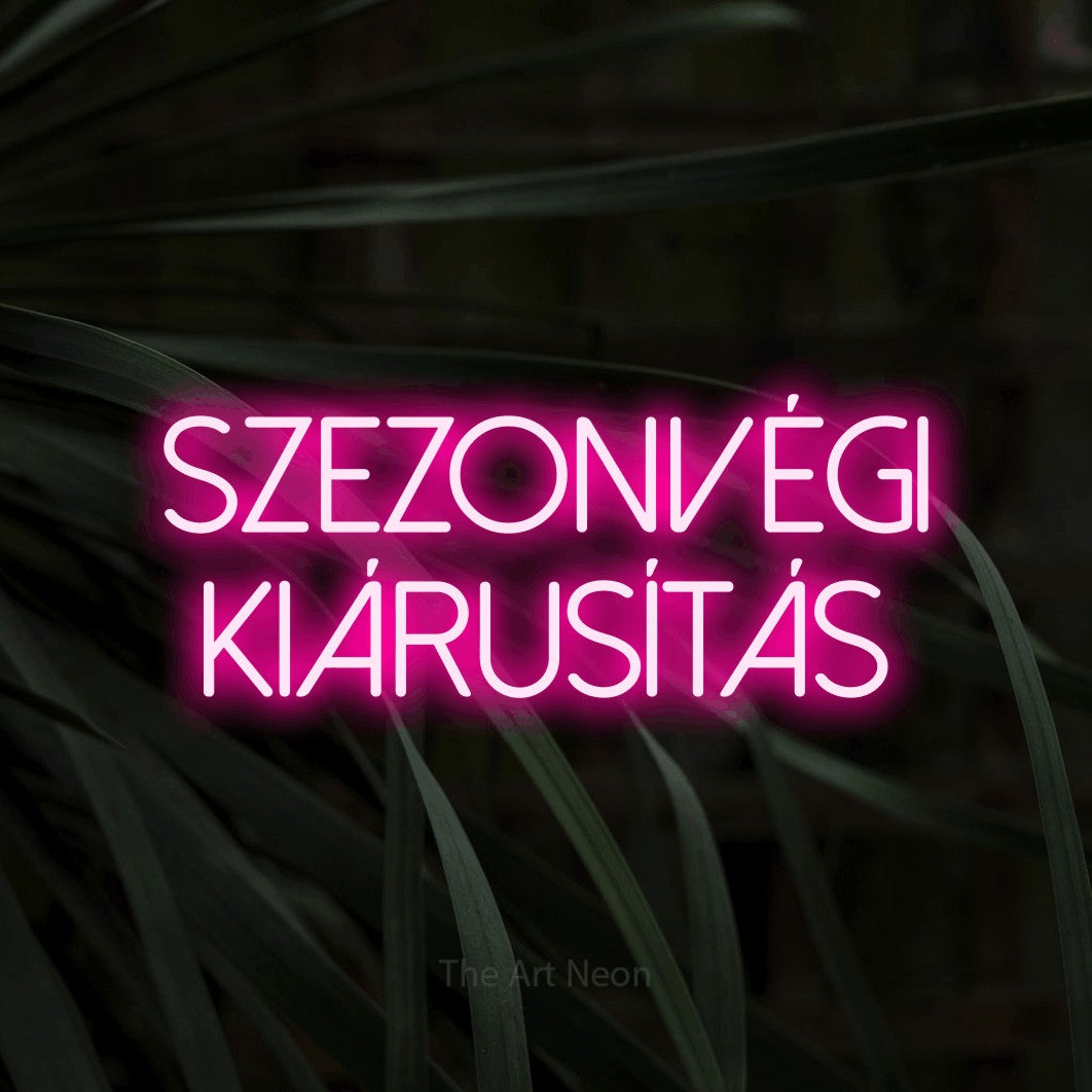 LED neon sign reading “szezonvégi kiárusítás”, arranged in two lines.