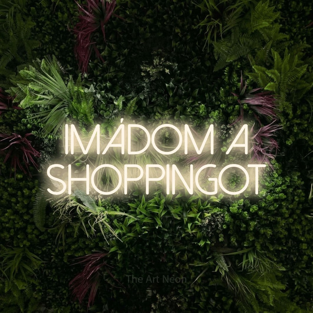 LED neon sign reading “IMÁDOM A SHOPPINGOT”, arranged in two lines.
