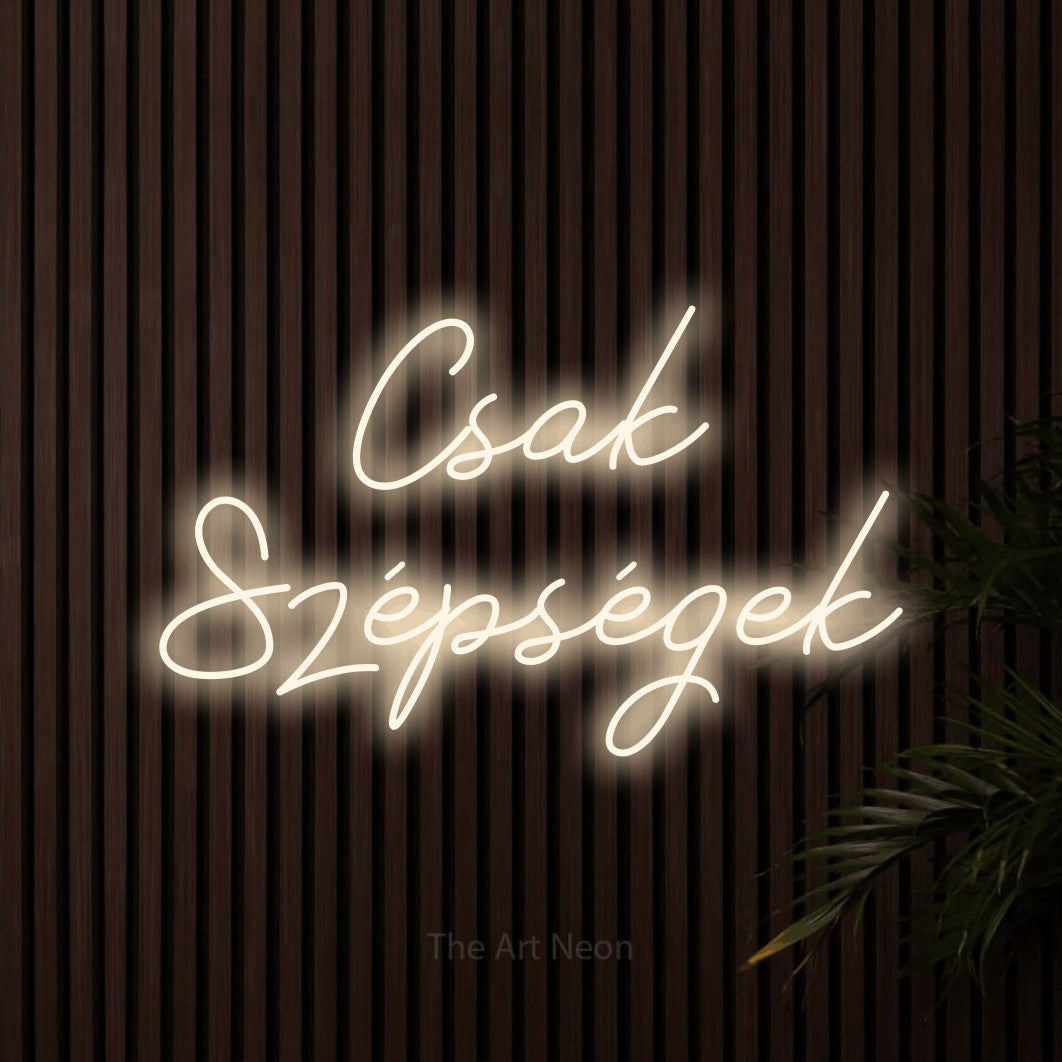 LED neon sign reading “Csak Szépségek”, arranged in two lines.
