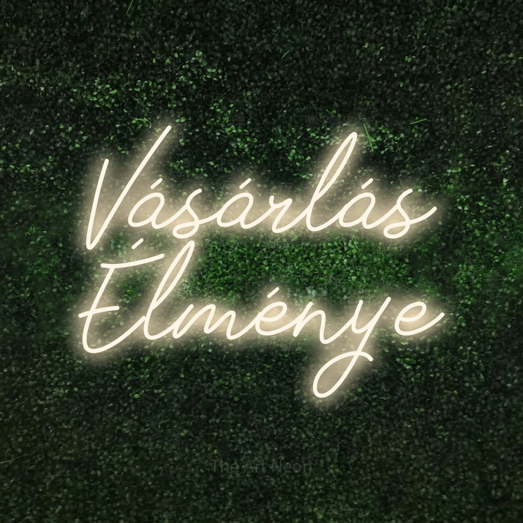 LED neon sign reading “Vásárlás Élménye”, arranged in two lines.
