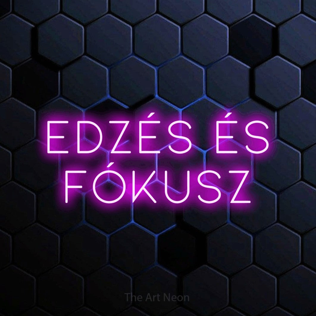 LED neon sign reading “edzés és fókusz”, arranged in two lines.