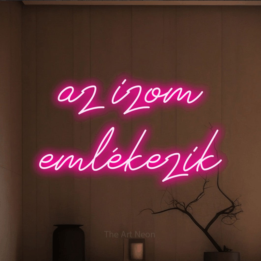LED neon sign reading “az izom emlékezik”, arranged in two lines.