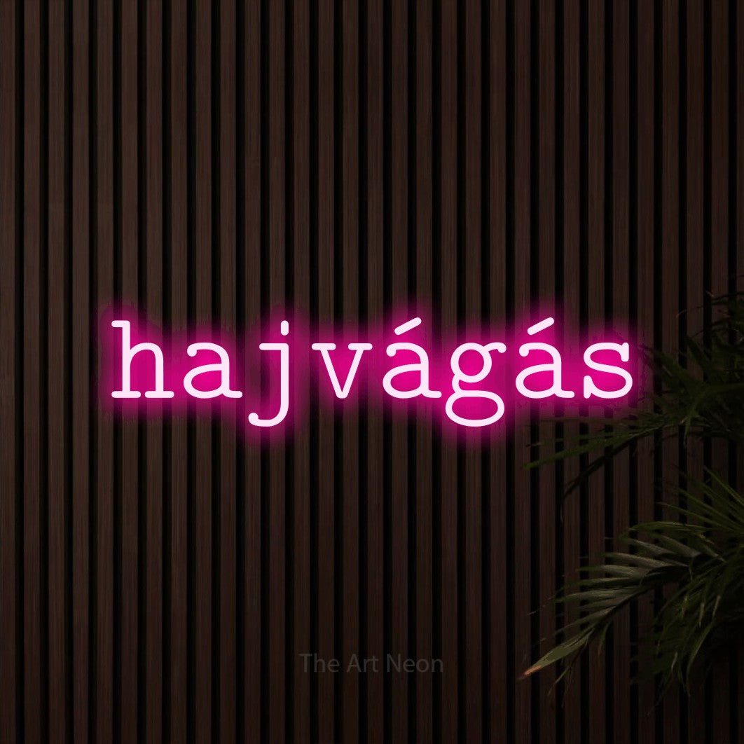 LED neon sign reading “hajvágás”, arranged in a single line.
