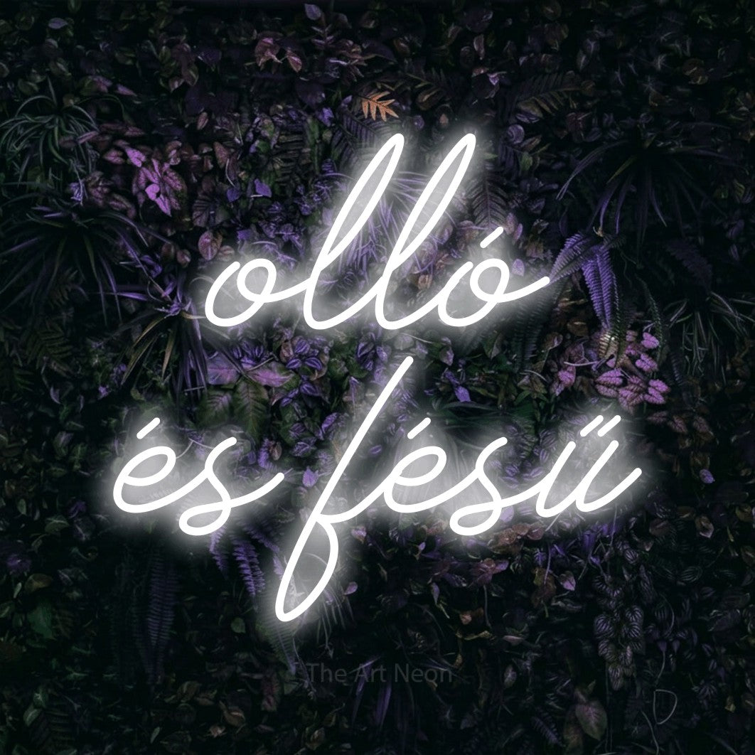 LED neon sign reading “olló és fésű”, arranged in two lines.