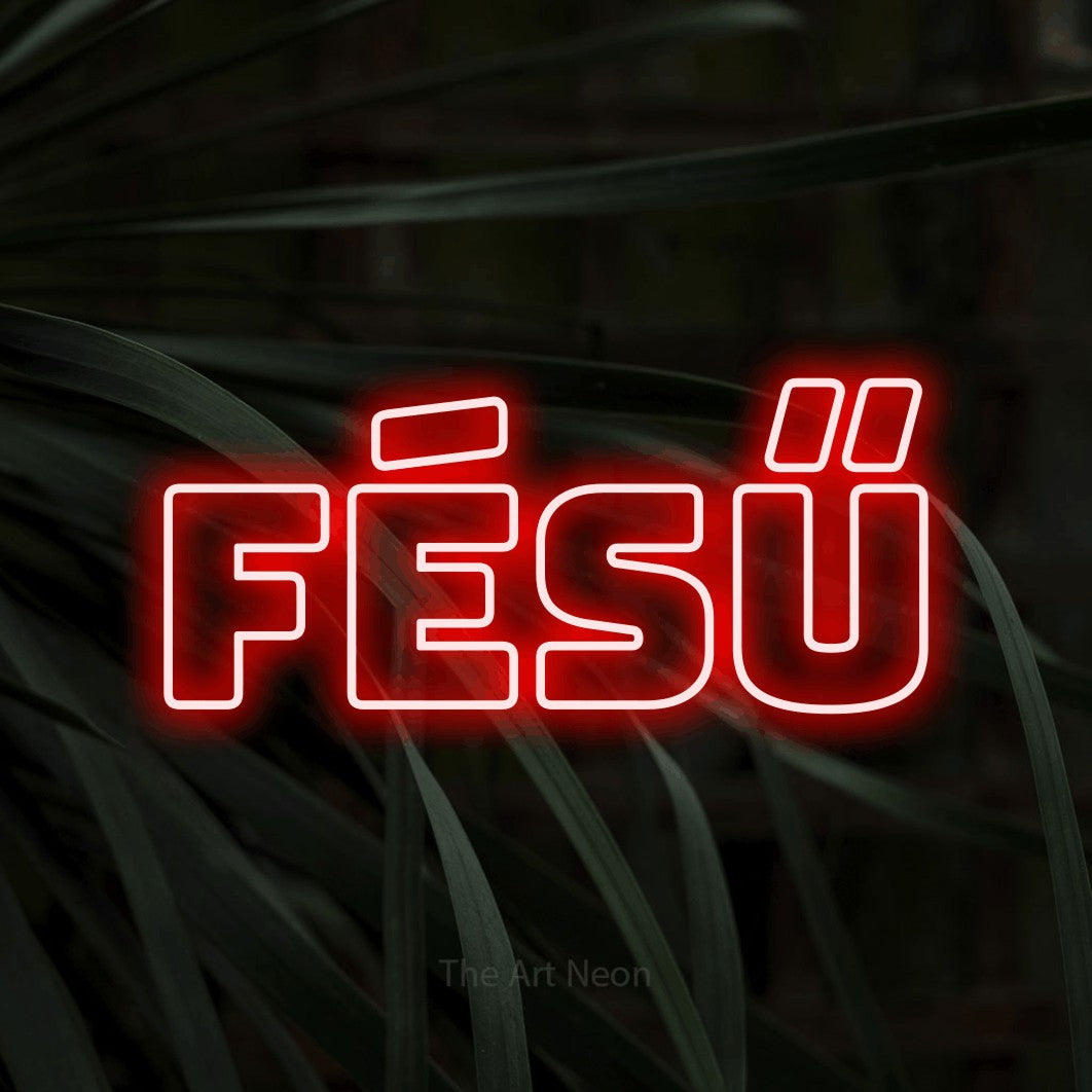 LED neon sign reading “Fésű”, arranged in a single line.