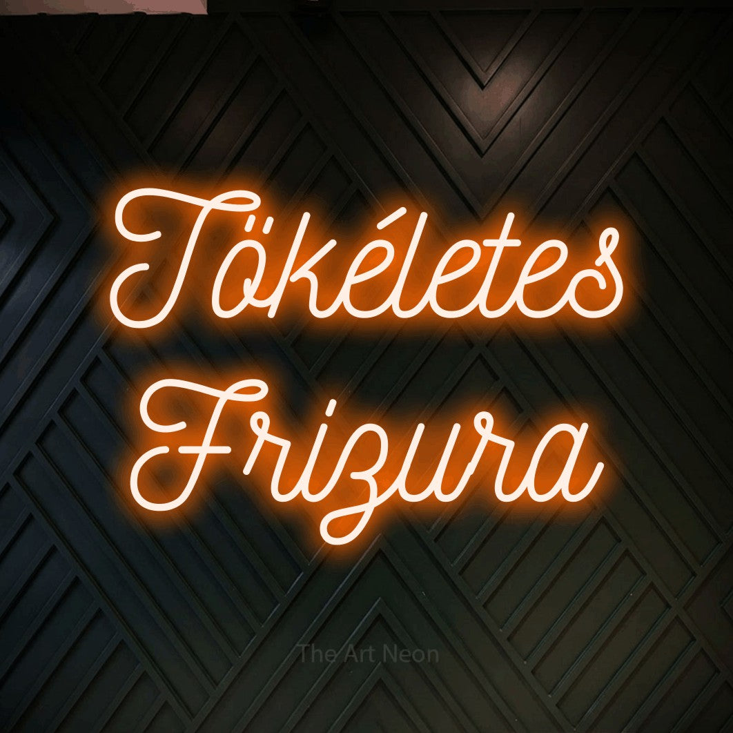 LED neon sign reading “Tökéletes Frizura”, arranged in two lines.