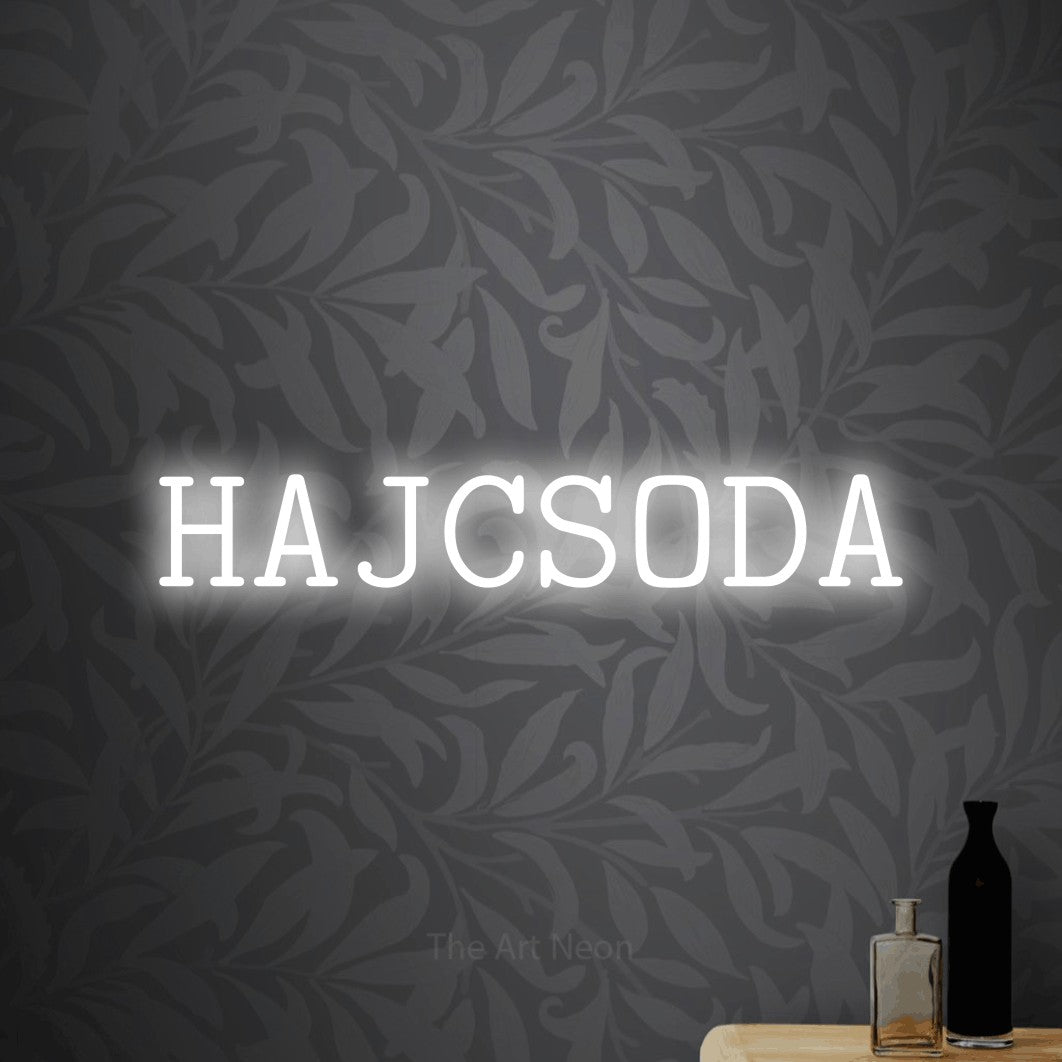 LED neon sign reading “HAJCSODA”, arranged in a single line.