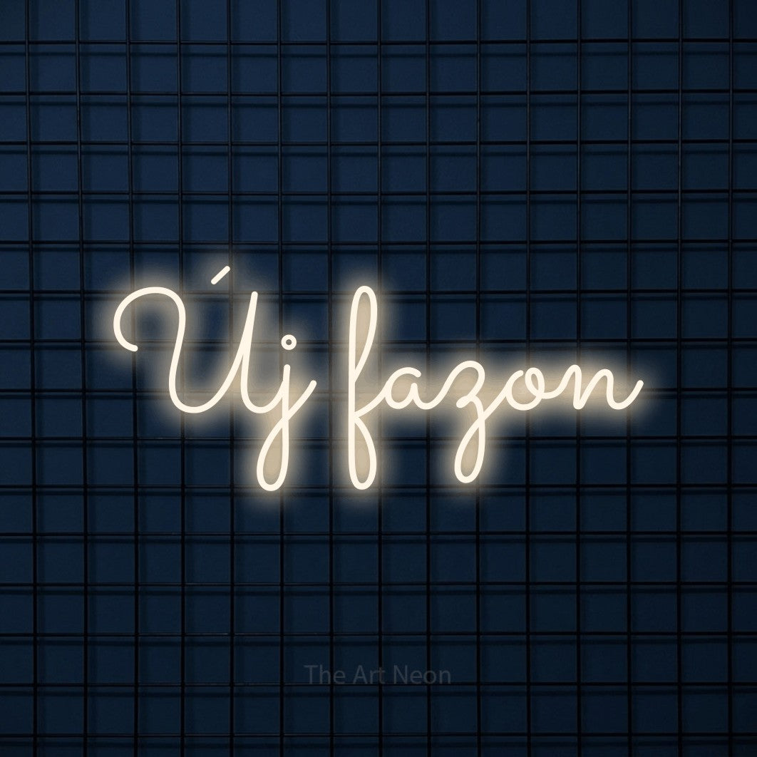 LED neon sign reading “Új fazon”, arranged in a single line.