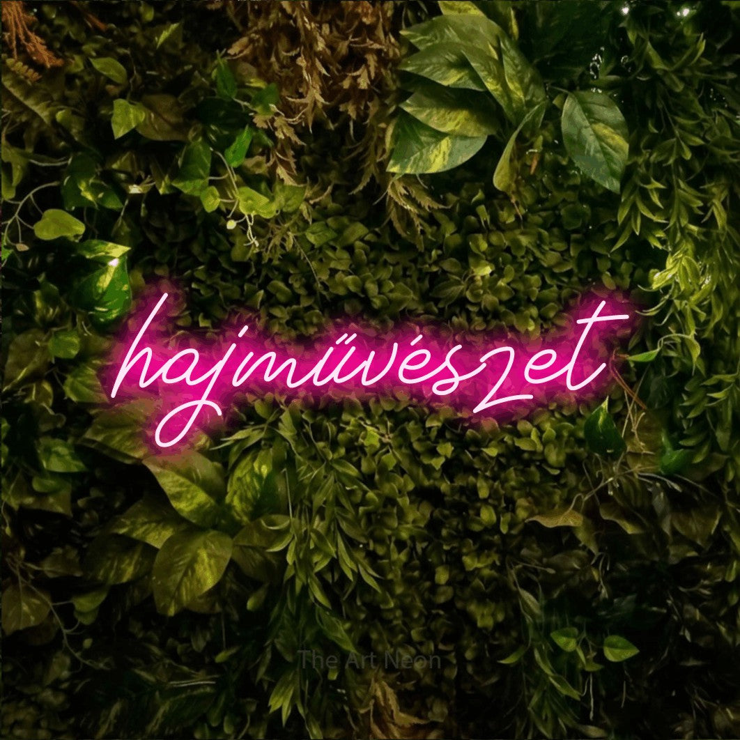 LED neon sign reading “hajművészet”, arranged in a single line.