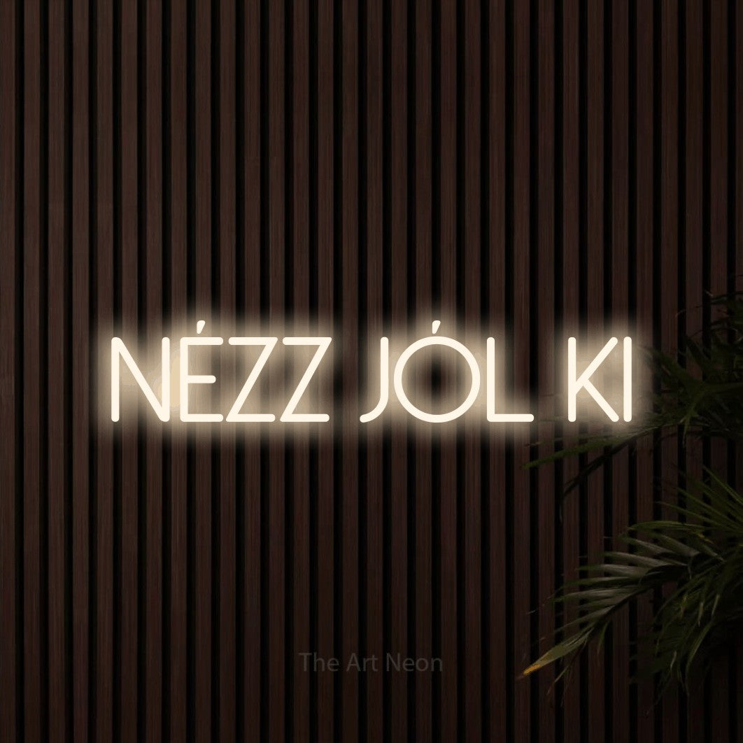 LED neon sign reading “NÉZZ JÓL KI”, arranged in a single line.