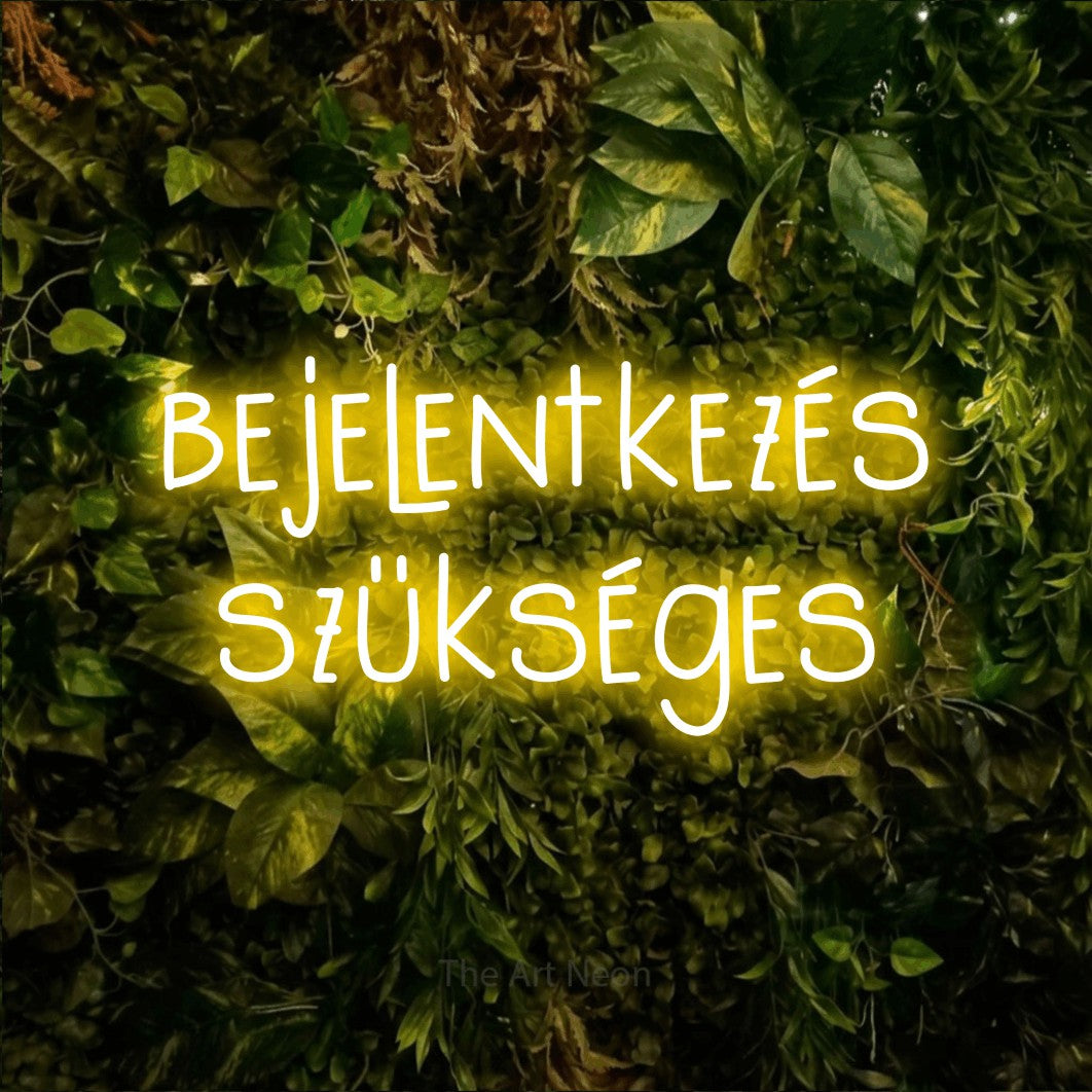 LED neon sign reading “bejelentkezés szükséges”, arranged in two lines.
