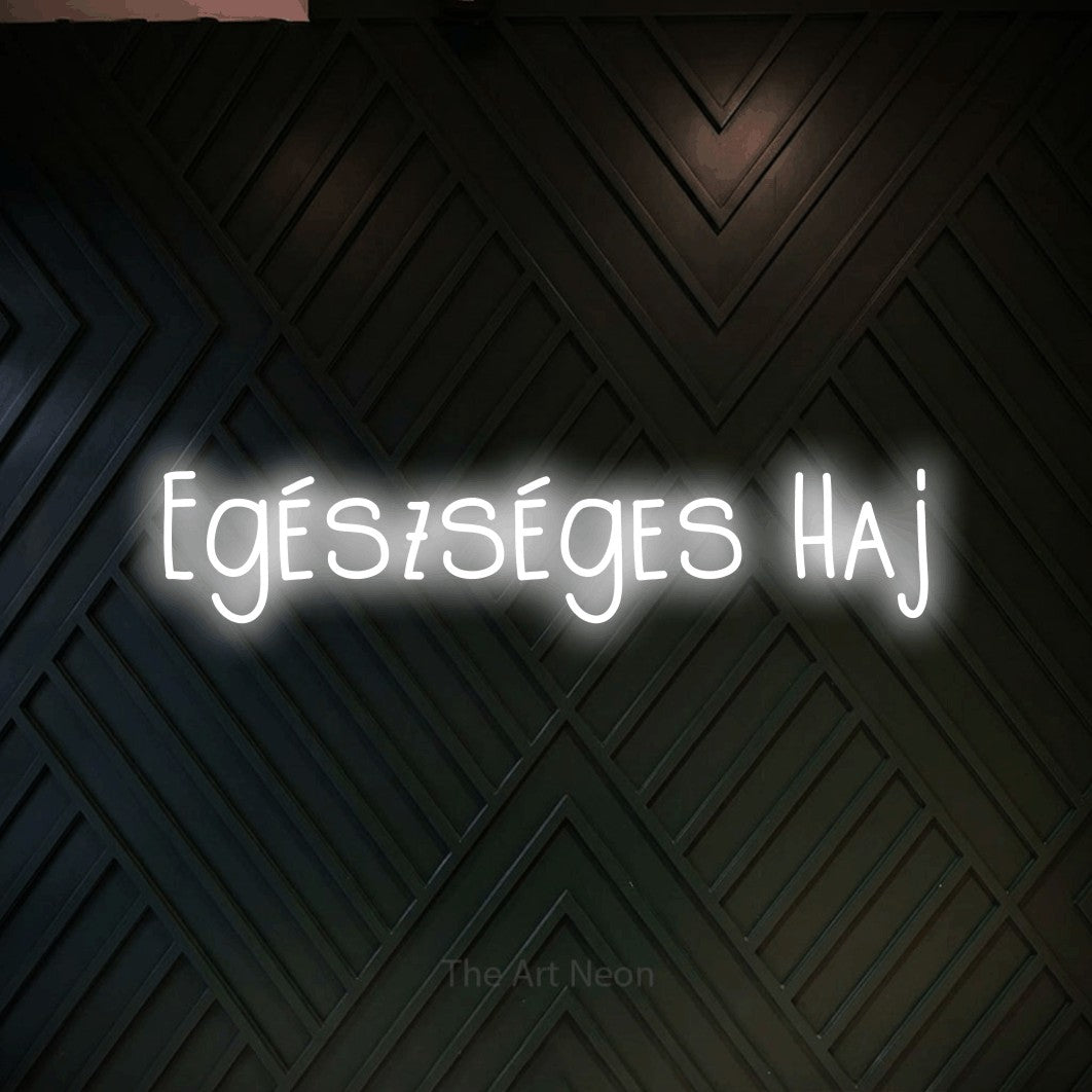 LED neon sign reading “Egészséges Haj”, arranged in a single line.