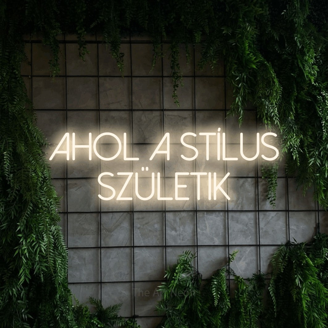 LED neon sign reading “AHOL A STÍLUS SZÜLETIK”, arranged in two lines.