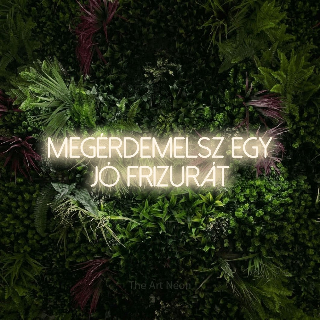 LED neon sign reading “megérdemelsz egy jó frizurát”, arranged in two lines.
