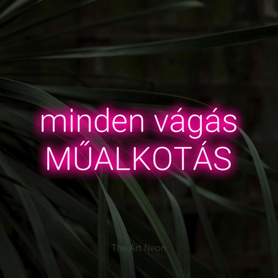 LED neon sign reading “minden vágás MŰALKOTÁS”, arranged in two lines.