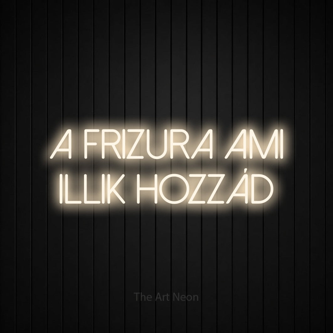 LED neon sign reading “A Frizura Ami Illik Hozzád”, arranged in two lines.