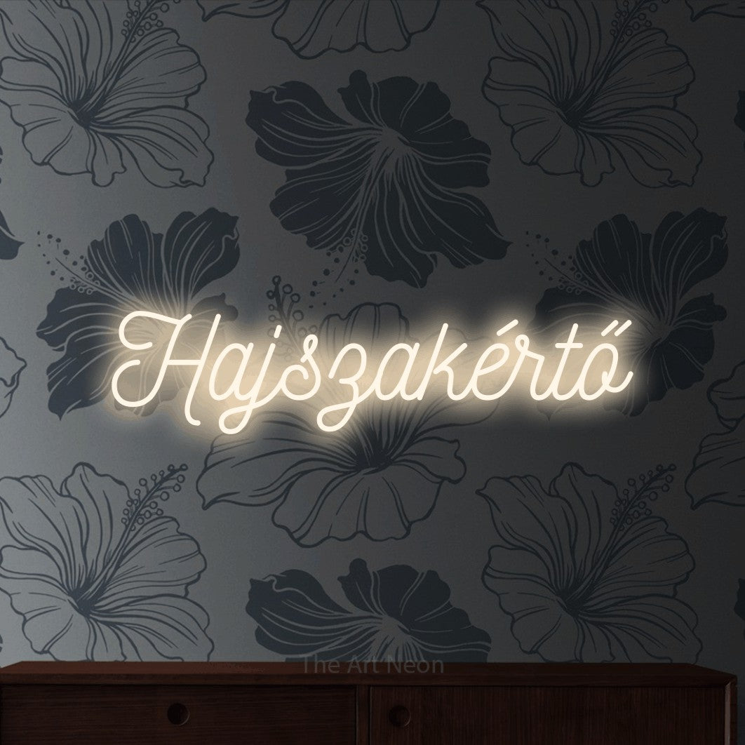 LED neon sign reading “Hajszakértő”, arranged in a single line.
