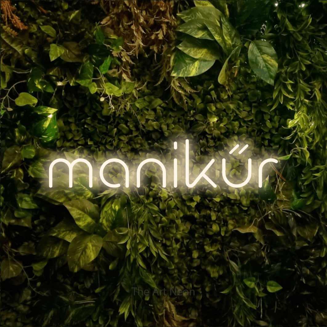 LED neon sign reading “manikűr”, arranged in a single line.