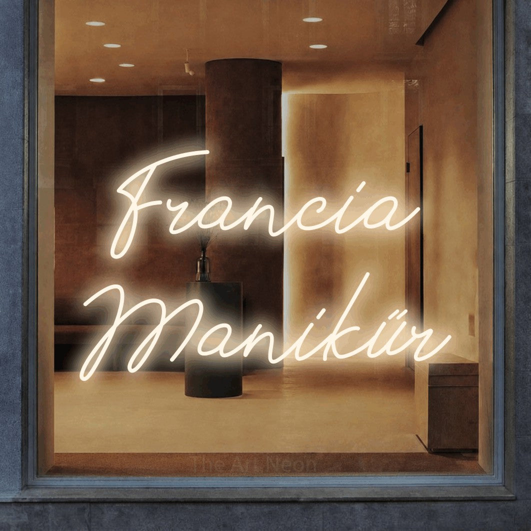 LED neon sign reading “Francia Manikűr”, arranged in two lines.