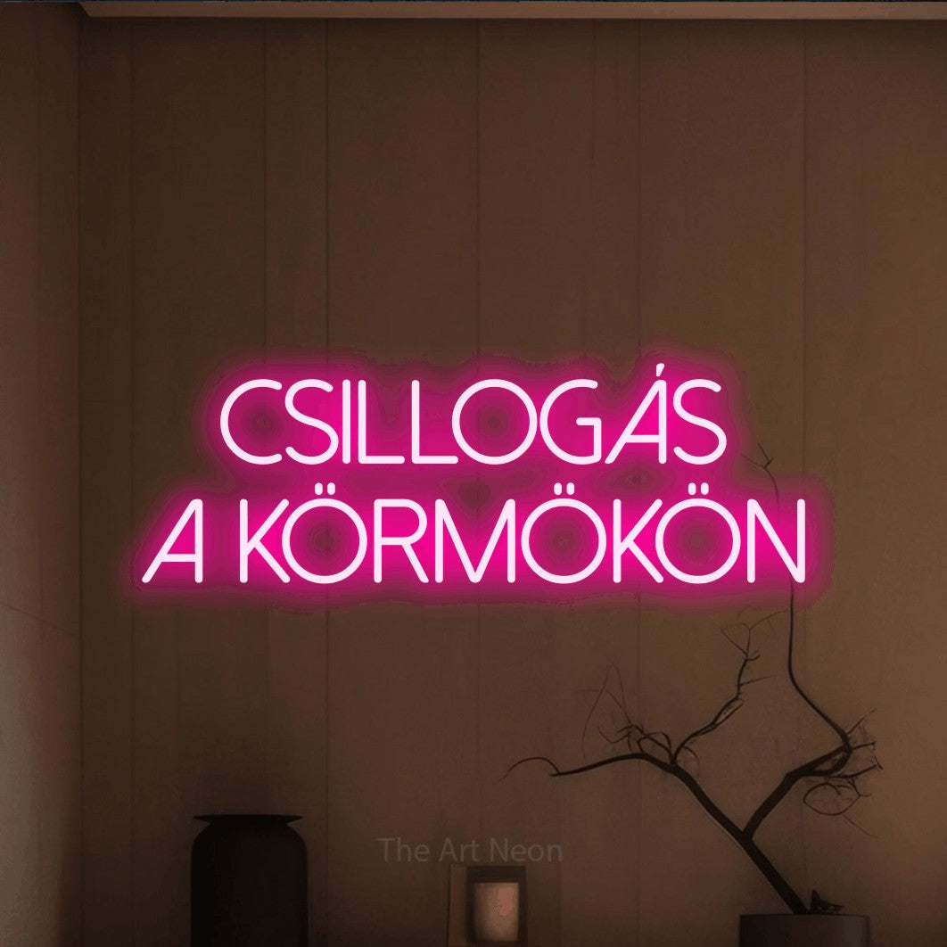 LED neon sign reading “Csillogás a körmökön”, arranged in two lines.