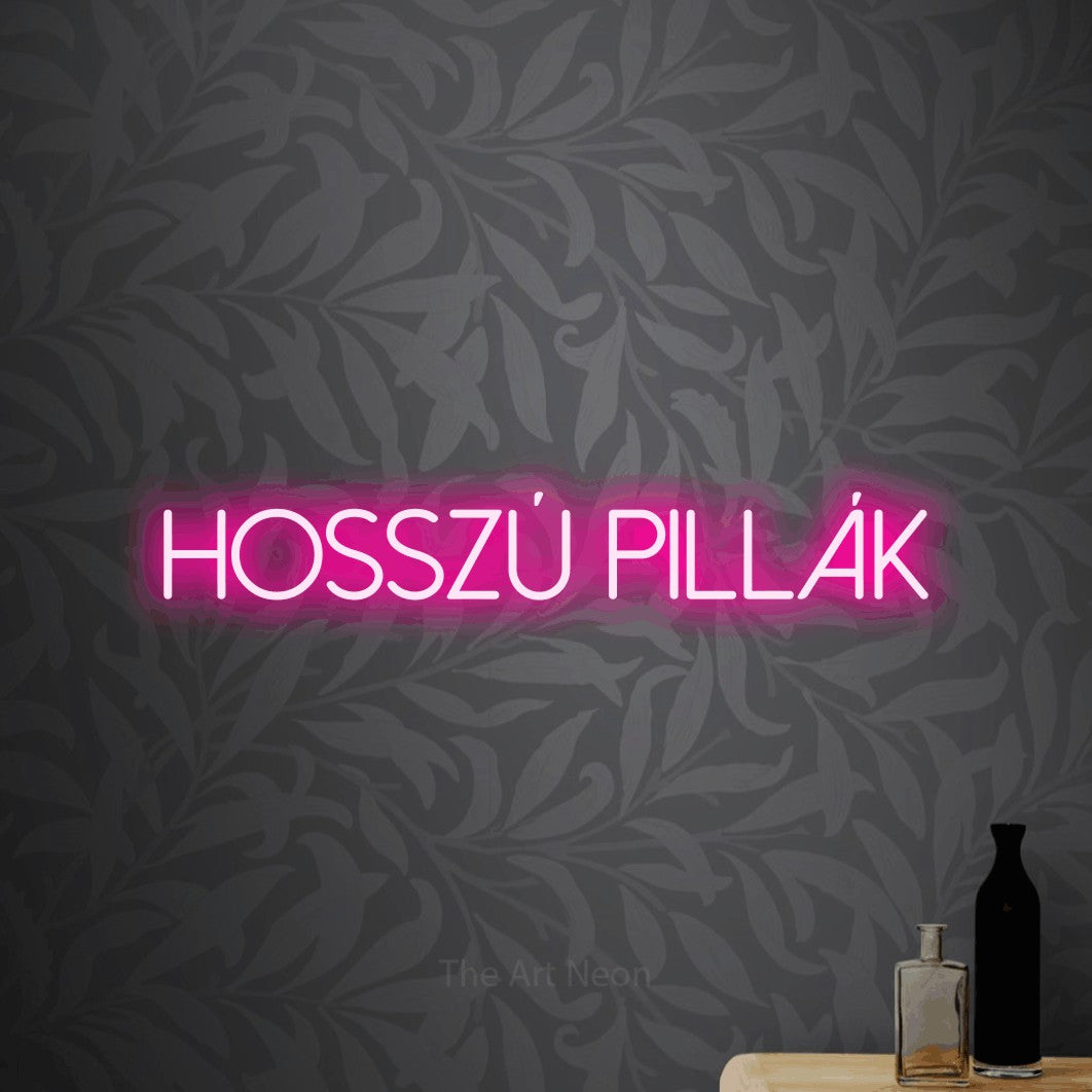 LED neon sign reading “Hosszú Pillák”, arranged in a single line.